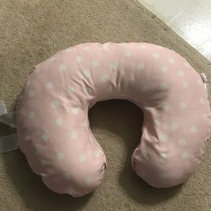 Girl Boppy Nursing Pillow baby, with a pink cover